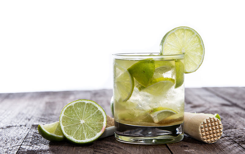 Table with Caipirinha isolated on white background